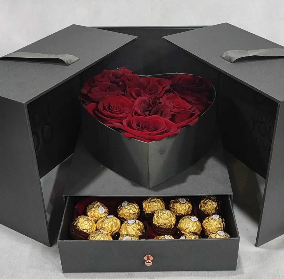 hidden heart of red flowers in black box