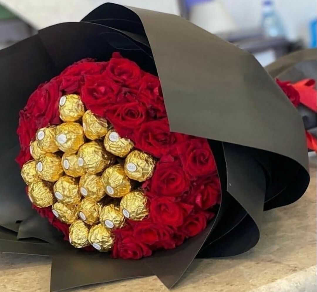 red flowers in black cover decorated with chocolate