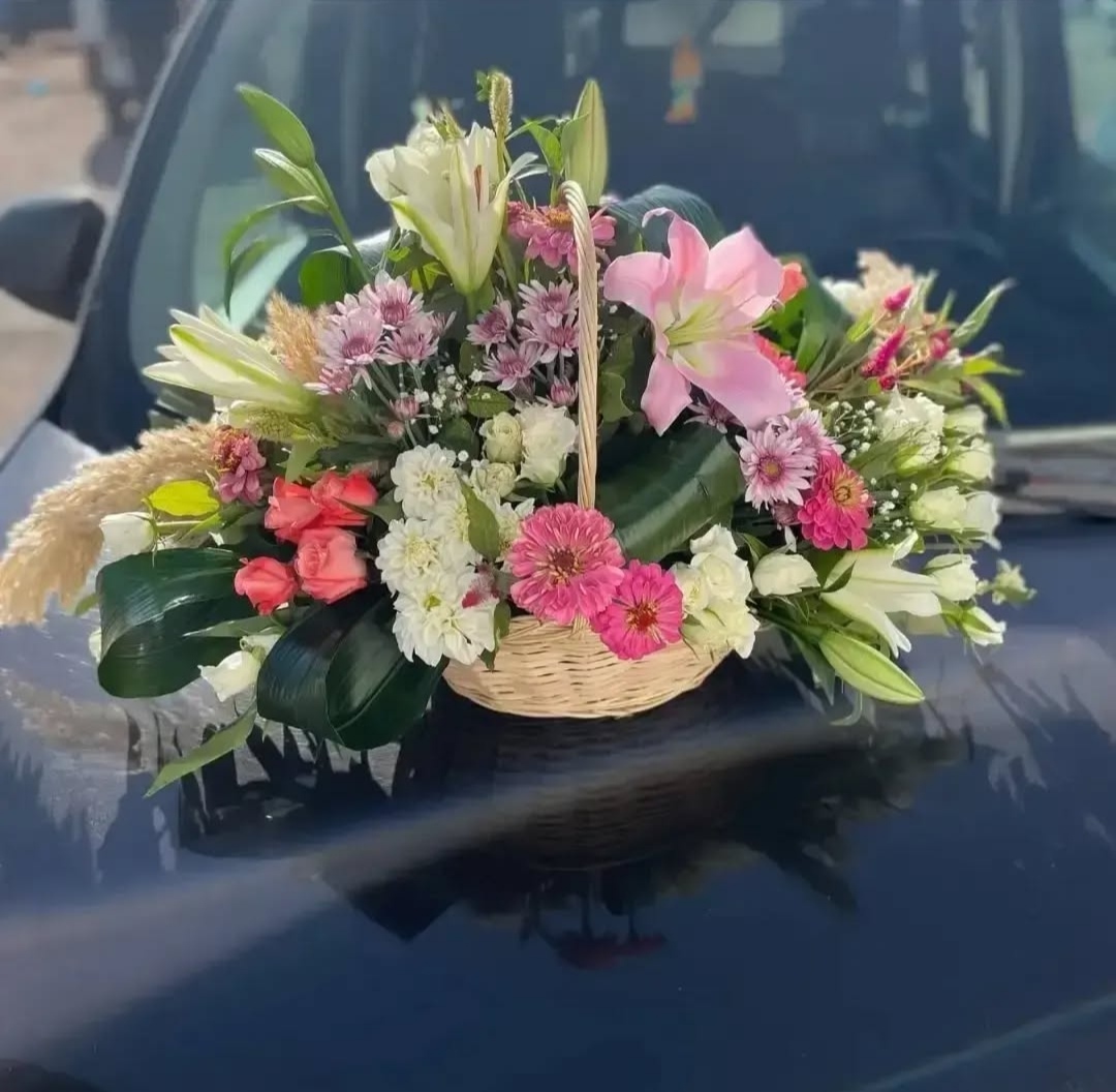 Basket filled with roses and flowers